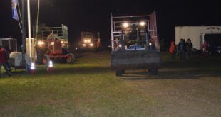 A fleet of tractors pulling trailers filled with gear and campers helped get everyone into Wizard Ranch smoothly on Friday evening.