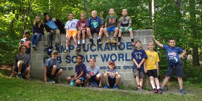Young people gathered at the Camp Tuckahoe Cub Scout World sign