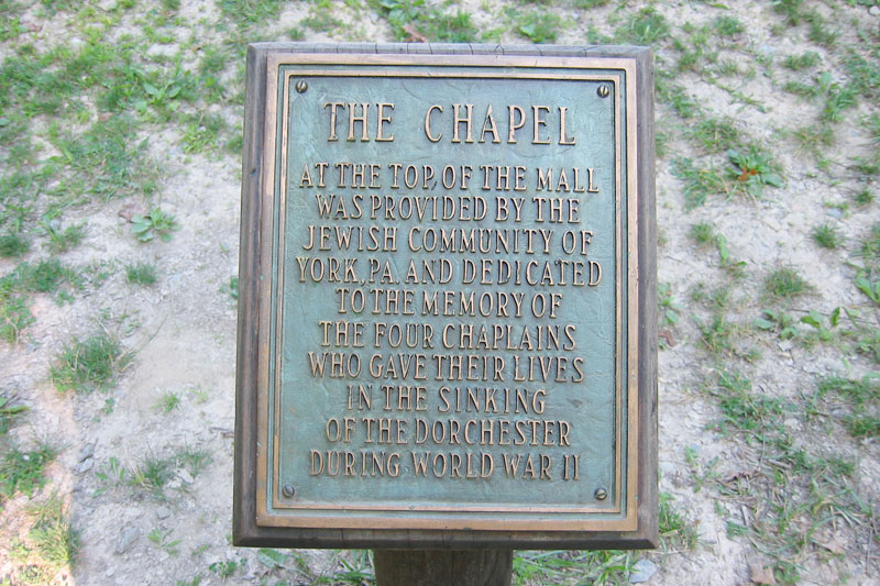 A World War II Memorial plaque honoring the interfaith story of the four chaplains.